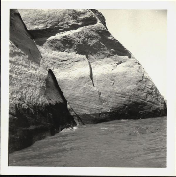 Photograph of the side facade wall from the Temple of Ellesiya, documenting the rising waters of Lake Nasser, which in a short time would have submerged the entire temple. Photograph taken from a boat.