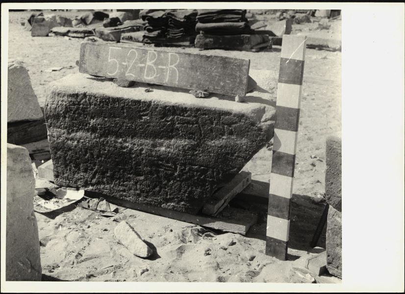 Storage at Wadi es-Sebua, one of the 66 blocks from the Temple of Ellesiya stored waiting to be transported to Turin, after the United Arab Republic decided to gift the temple to the Italian Republic. Lower register from the left wall of the chapel, where there are some inscriptions. 