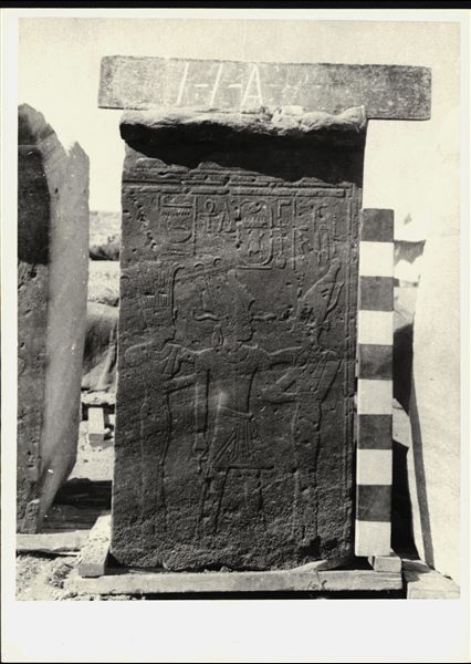 Storage at Wadi es-Sebua, one of the 66 blocks from the Temple of Ellesiya stored waiting to be transported to Turin, after the United Arab Republic decided to gift the temple to the Italian Republic. Wall scene to the left of the transverse hall’s entrance, where Pharaoh Thutmosis III, wearing the Atef crown, is shown between the goddess Anuket (left) and the goddess Satet (right); goddesses of the cataract at Aswan. 
