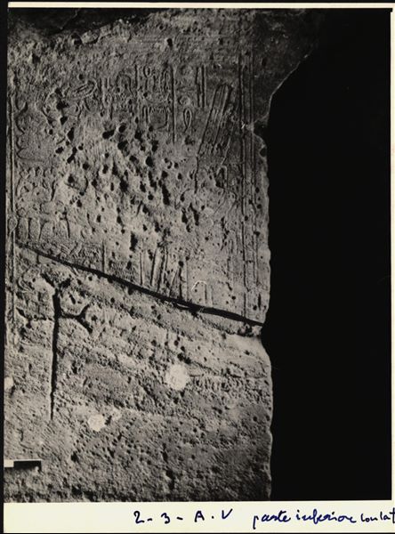 Two of the 66 blocks from the Temple of Ellesiya. Scene on the back left wall of the transverse hall (opening to the right of the chapel), depicting the god Amun-Ra seated on a throne in front of a pile of offerings. Below the wall scene, a Christian cross is visible.  