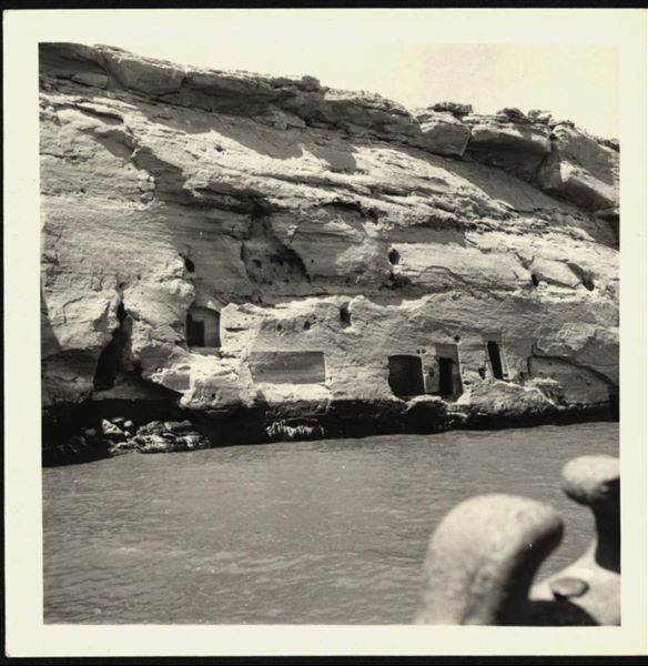 Photograph taken in the area of the rock-cut chapel in Qasr Ibrim, where some rooms and openings carved into the rock can be seen. 