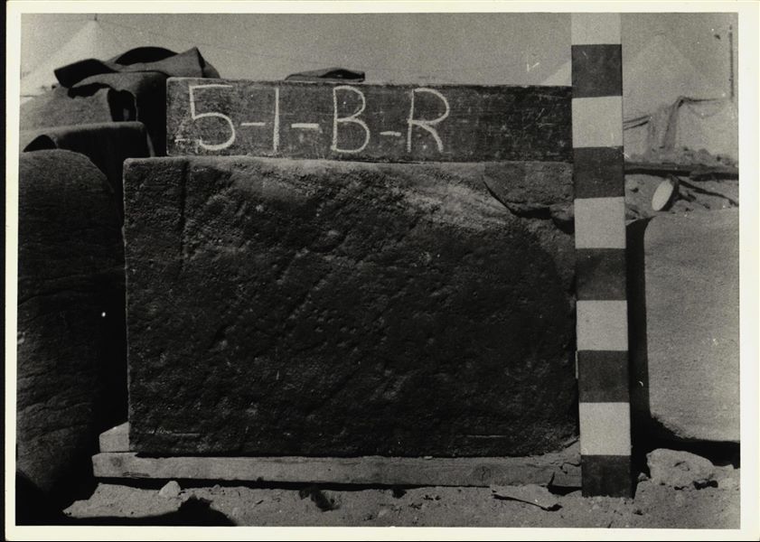 Storage at Wadi es-Sebua, one of the 66 blocks from the Temple of Ellesiya stored waiting to be transported to Turin, after the United Arab Republic decided to gift the temple to the Italian Republic. Scene depicting the Viceroy Setau praying to Amun-Ra and Horus, right wall of the chapel. 