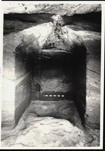 Photograph of the back niche in the Temple of Ellesiya, where the statues of deities and the pharaoh (Horus of Miam, Thutmosis III and Satet) were located. The temple is in its original location in Nubia, shortly before the Nile waters would begin to rise due to the construction of the Aswan Dam, which would flood the area. Photograph taken in the mid-1960s, shortly before the temple was moved. Note the original floor, which was not saved.