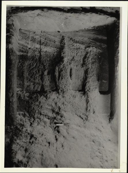 Photograph of the back niche in the Temple of Ellesiya, where the statues of deities and the pharaoh are located; depicting Horus of Miam, the goddess Satet, and in the centre, the ruler Thutmosis III. The photograph was taken in the temple’s original location in Nubia, shortly before the Nile waters would begin to rise due to the construction of the Aswan Dam, which would flood the area. Photograph taken in the mid-1960s, shortly before the temple was moved. Note the original floor, which was not saved.