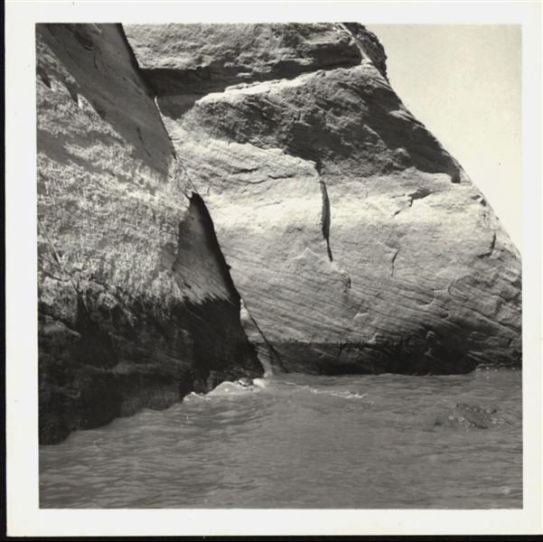 Photograph of the side facade wall from the Temple of Ellesiya, showing the rising waters of Lake Nasser, which in a short time would have submerged the entire temple. Photograph taken from a boat. 