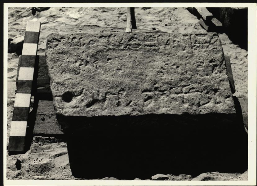 Storage at Wadi es-Sebua, one of the 66 blocks from the Temple of Ellesiya stored waiting to be transported to Turin, after the United Arab Republic decided to gift the temple to the Italian Republic. One of the blocks forming part of the right side of the recess, on the temple's exterior façade.