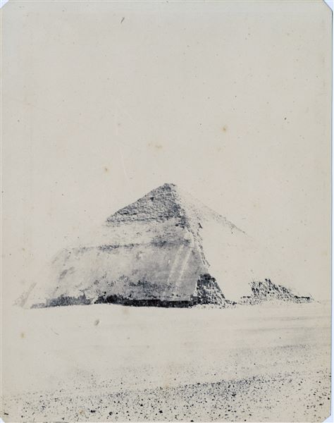 The Bent Pyramid erected by Snefru, the first pharaoh of the 4th dynasty, predecessor (and also 	possibly the father) of Cheops (Khufu). This pyramid (the second built by the ruler) marks the 	turning point in the transition from the previously constructed step pyramids to the “smooth-sided” or “canonical-shaped” pyramids. This type would become the standard for later pyramids. Due to a long exposure time, the photograph is very light. 