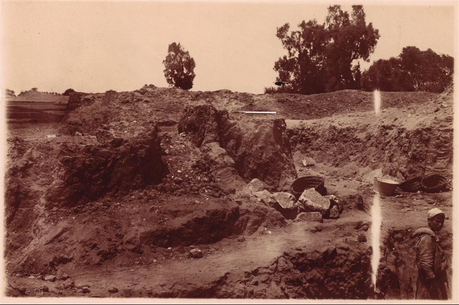 Excavating in one of the areas of the archaeological site of Heliopolis. The print shows an overexposure with another photograph, presumably of the same site. Schiaparelli excavations.