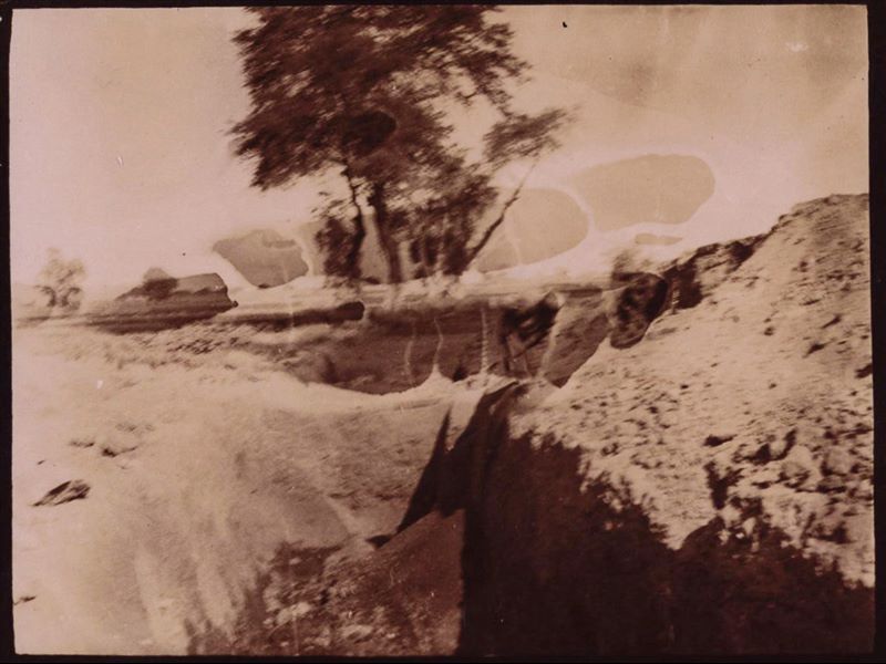 Photograph of an excavation trench wall during work in Heliopolis by the Italian Archaeological Mission. The photograph is very faint. Schiaparelli excavations.