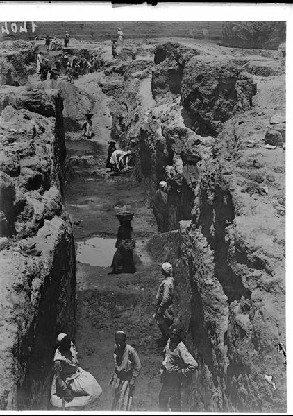 Excavating in the area of the Sun Temple; the garden of Latif can be seen in the background. Schiaparelli excavations.