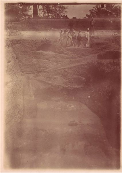 Excavation trench in the area of the Sun Temple. The wall of Latif's house is in the background. Photograph overexposed and in sepia. Schiaparelli excavations.