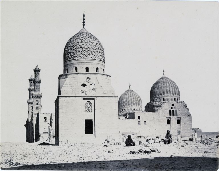 Islamic Northern Cemetery in Cairo, where several domes of Mamluk mausoleums can be seen. The twin domes belong to the mosque of the funerary complex and the khanqah of Sultan Faraj ibn Barquq. The author's signature is faintly visible in the bottom right-hand corner.   