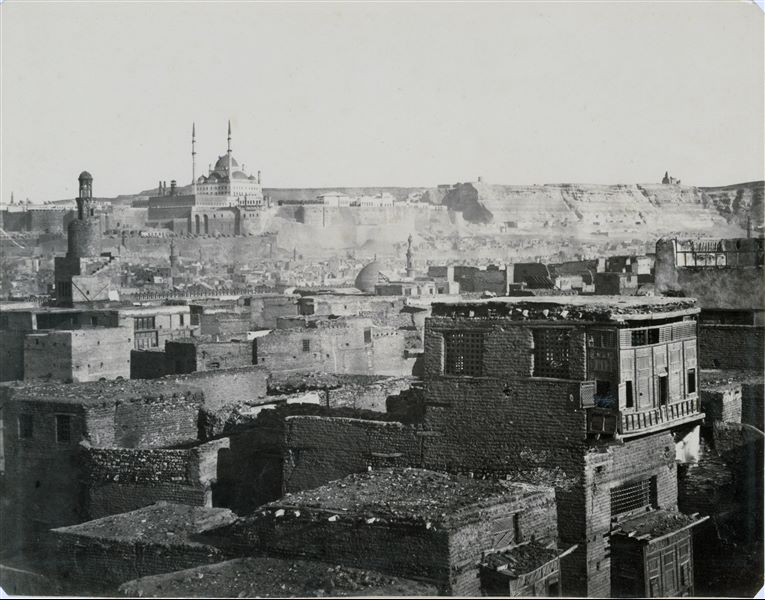 Panorama of the city of Cairo, showing the Citadel and the impressive Mosque of Mohammed Ali in the distance. In the foreground on the left, the spiral minaret of the Ahmed Ibn Tulun Mosque, one of the largest and oldest mosques in Cairo (9th century) is visible.   