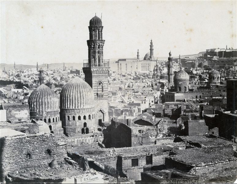 Panorama of the city of Cairo, where several minarets and mosques can be seen. In the background on the right, there is the massive Citadel boundary wall as well as the Bab al-Azab, which is the main entrance to the Citadel, and still exists today.    