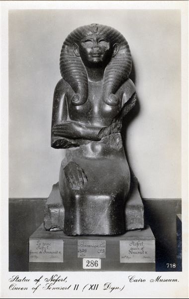 Gallery in the Egyptian Museum in Cairo. Statue of Queen Nofret, daughter of Amenemhat II and wife of Pharaoh Sesostris II, 12th dynasty (Cairo JE 37487). Album “Cartes postales” (Postcards).