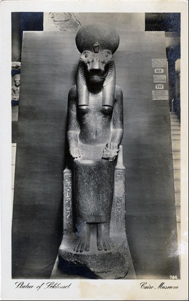 Gallery in the Egyptian Museum in Cairo. Statue of the goddess Sekhmet. Album “Cartes postales” (Postcards).