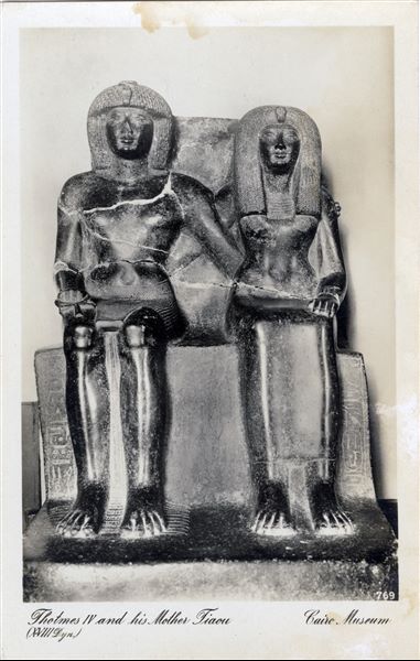 Gallery in the Egyptian Museum in Cairo. Statue of Pharaoh Tuthmosis IV and his mother Tiaa, 18th dynasty. Album “Cartes postales” (Postcards).