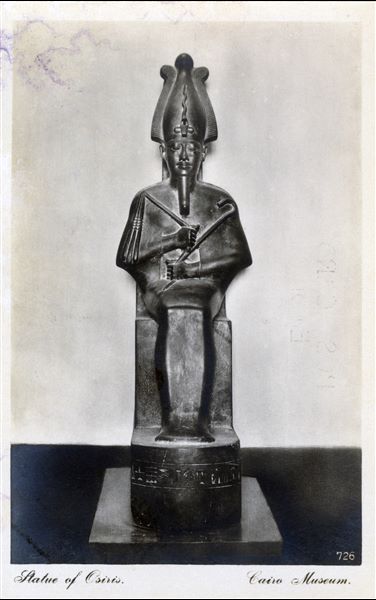 Gallery in the Egyptian Museum in Cairo. Statue of Osiris. Album “Cartes postales” (Postcards).
