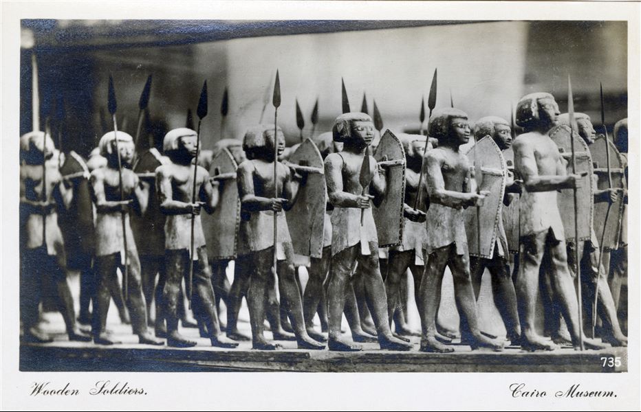 Display case in the Egyptian Museum in Cairo, housing a platoon of miniature wooden soldiers (Cairo CG 258), discovered at the end of the 19th century in the tomb of Mesehti, governor of the 13th nome, early Middle Kingdom. Album “Cartes postales” (Postcards).   