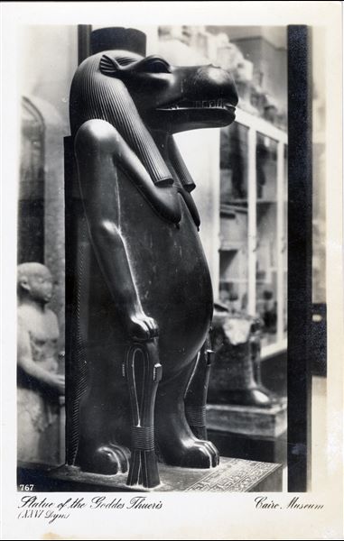Gallery in the Egyptian Museum in Cairo. Statue of the goddess Taweret. Album “Cartes postales” (Postcards).