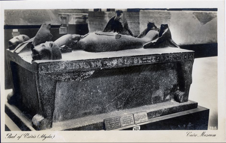 Gallery in the Egyptian Museum in Cairo. The so-called bed of the god Osiris, in black granite, found at Abydos in what was believed to be the god's tomb. It probably dates back to the Late Period (26th dynasty). Album “Cartes postales” (Postcards).