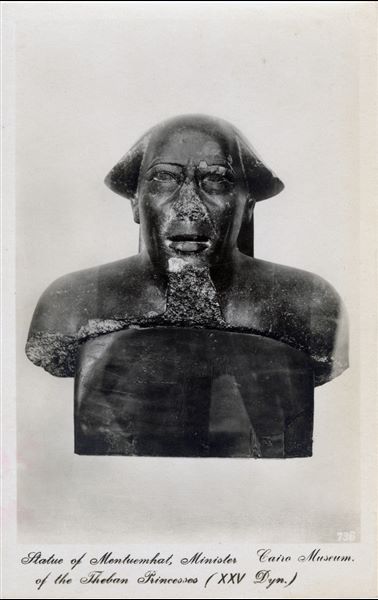 Gallery in the Egyptian Museum in Cairo. Bust of Montuemhat, Fourth Prophet of Amun, Mayor of Thebes and Governor of Upper Egypt. 26th dynasty (Cairo JE 31884). Album “Cartes postales” (Postcards). 