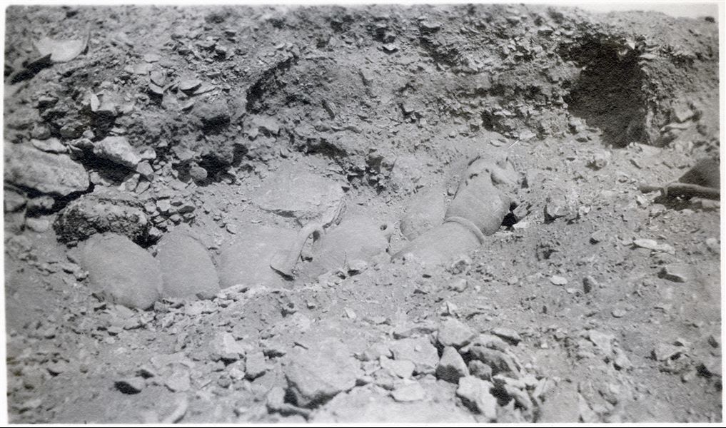 Photograph taken at the time of discovering some intact vases during excavations by the Italian Archaeological Mission in Giza. Schiaparelli excavations. 