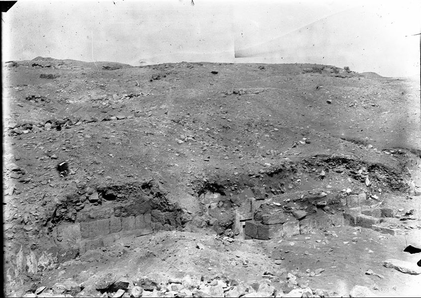 Landscape of the Giza area, with focus on the remains of a mastaba. At the bottom, the lintel of the false-door can be seen. Schiaparelli excavations.