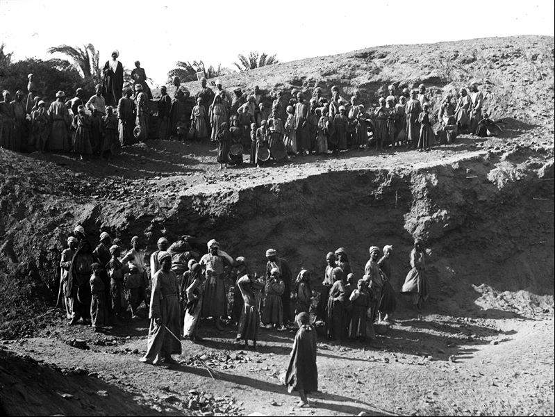Workers posing for the camera during a rest break whilst excavating at the site. Schiaparelli excavations.