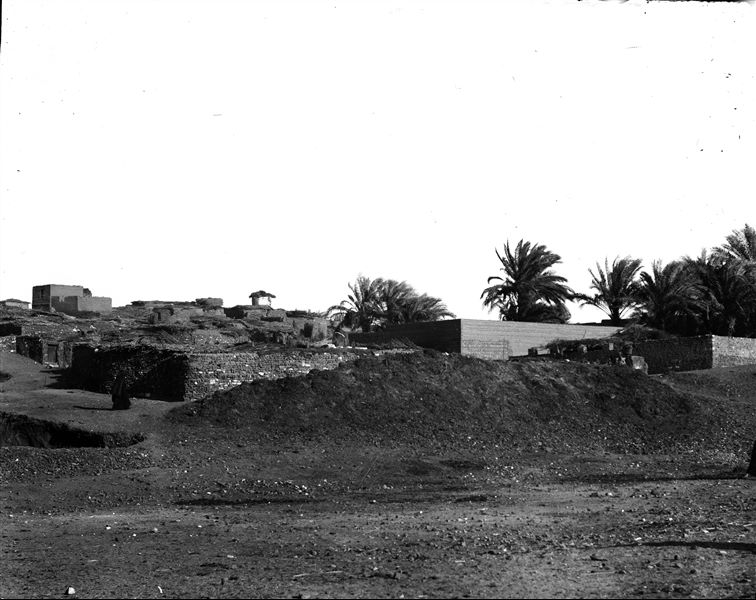 Area near the excavations, part of the modern village can be seen. Schiaparelli excavations.