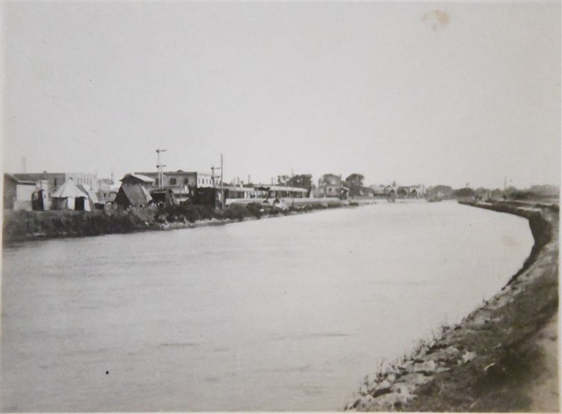 Railway station near a canal, probably in Minia. Angelo Sesana Archive. 