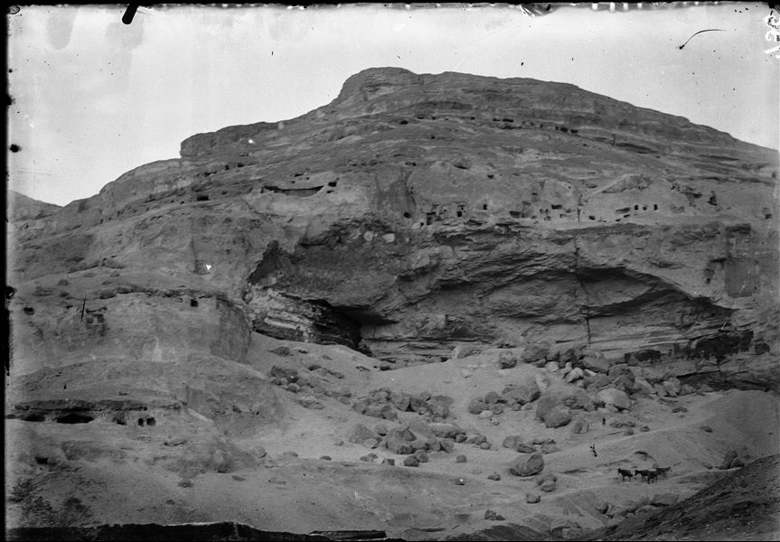 Assiut, the rock-cut tombs viewed from the city. Schiaparelli excavations.