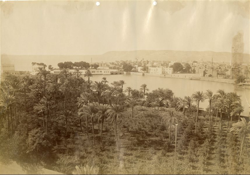 The photograph shows a view of the village of Asyut during one of the Nile’s floods.