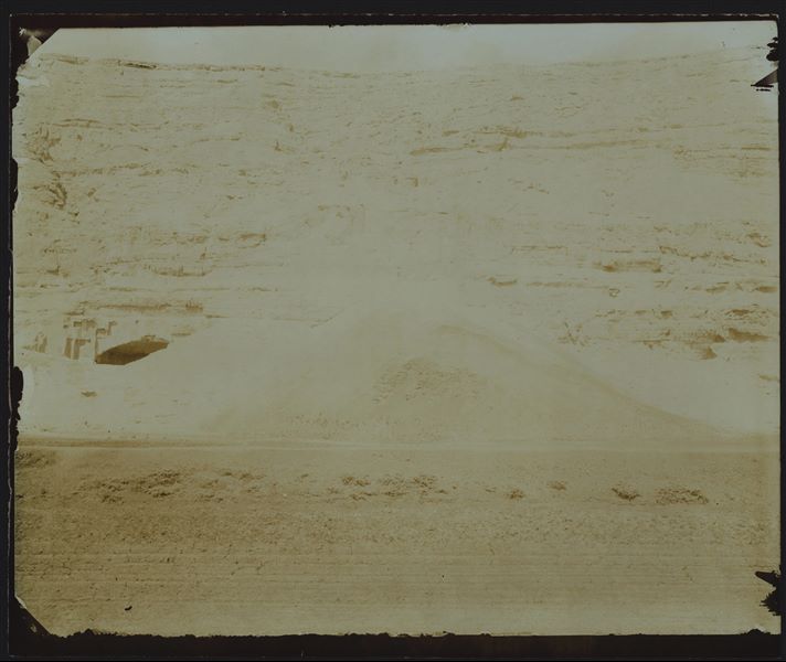 View of the cave in the mountain of Qau, photographed from the plain, used as a camp by the Italian Archaeological Mission. Two conical tents of the mission can be seen near the entrance. Schiaparelli excavations.