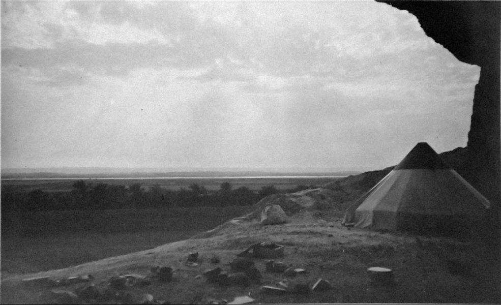 Italian Archaeological Mission’s camp in Qau el-Kebir. The photograph shows the landscape that could be viewed from the cave. In the foreground, one of the mission's conical tents. Angelo Sesana Archive. 