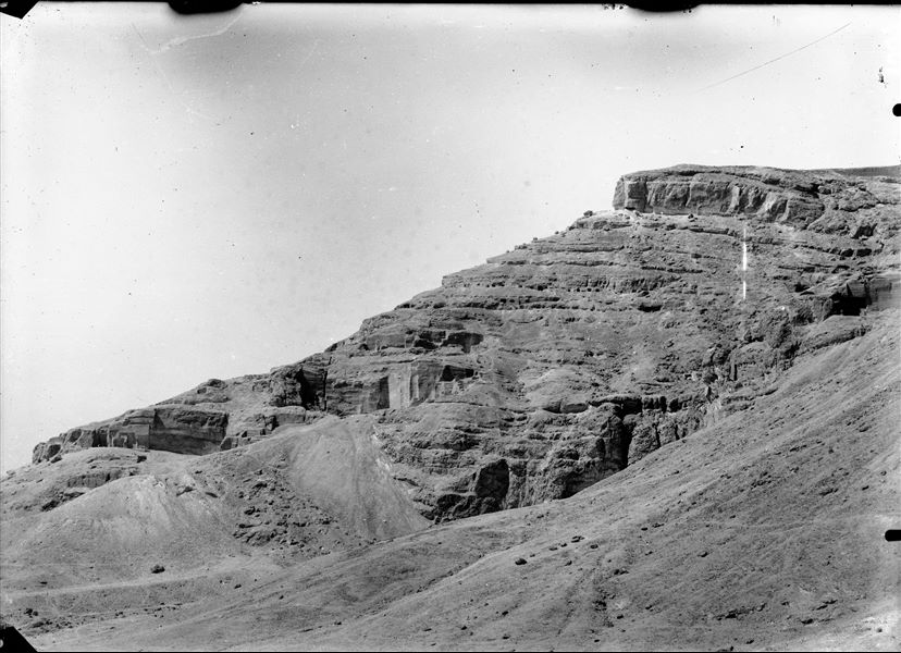 Qau el-Kebir, general view of the area presumably towards the east, the caves being used as quarries are visible here. Schiaparelli excavations.   