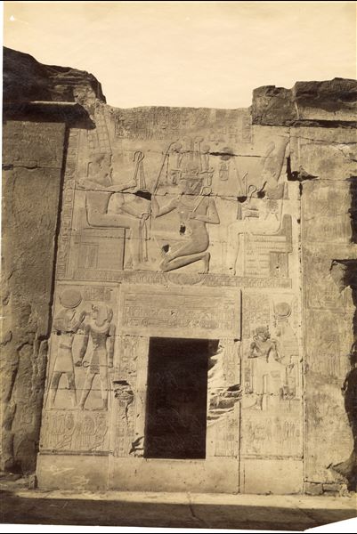 The image shows decorative scenes from the back wall of the second hypostyle hall of the Temple of Pharaoh Seti I at Abydos, where the king is depicted worshipping Amun. The author's signature is at the lower left.  