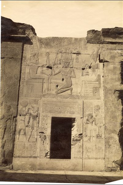 The image shows decorative scenes from the back wall of the second hypostyle hall of the Temple of Pharaoh Seti I at Abydos, where the king is depicted worshipping Amun. The author's signature is at the lower left.  