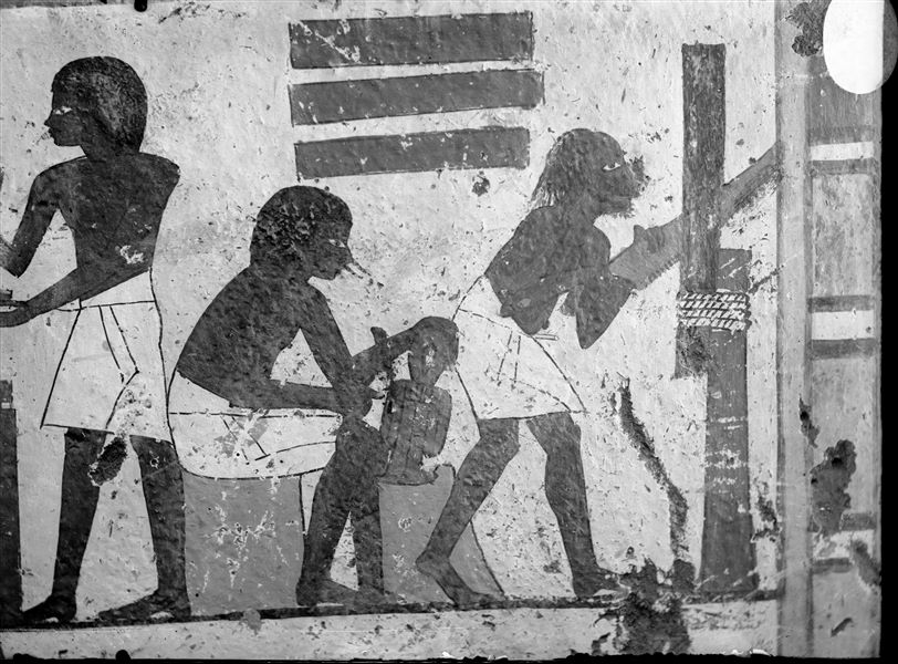 Tomb of Ipuky and Nebamun (TT 181). Detail from the south-eastern wall in the transverse chamber, depicting three craftsmen at work. The craftsman in the centre is carving an Isis knot. 